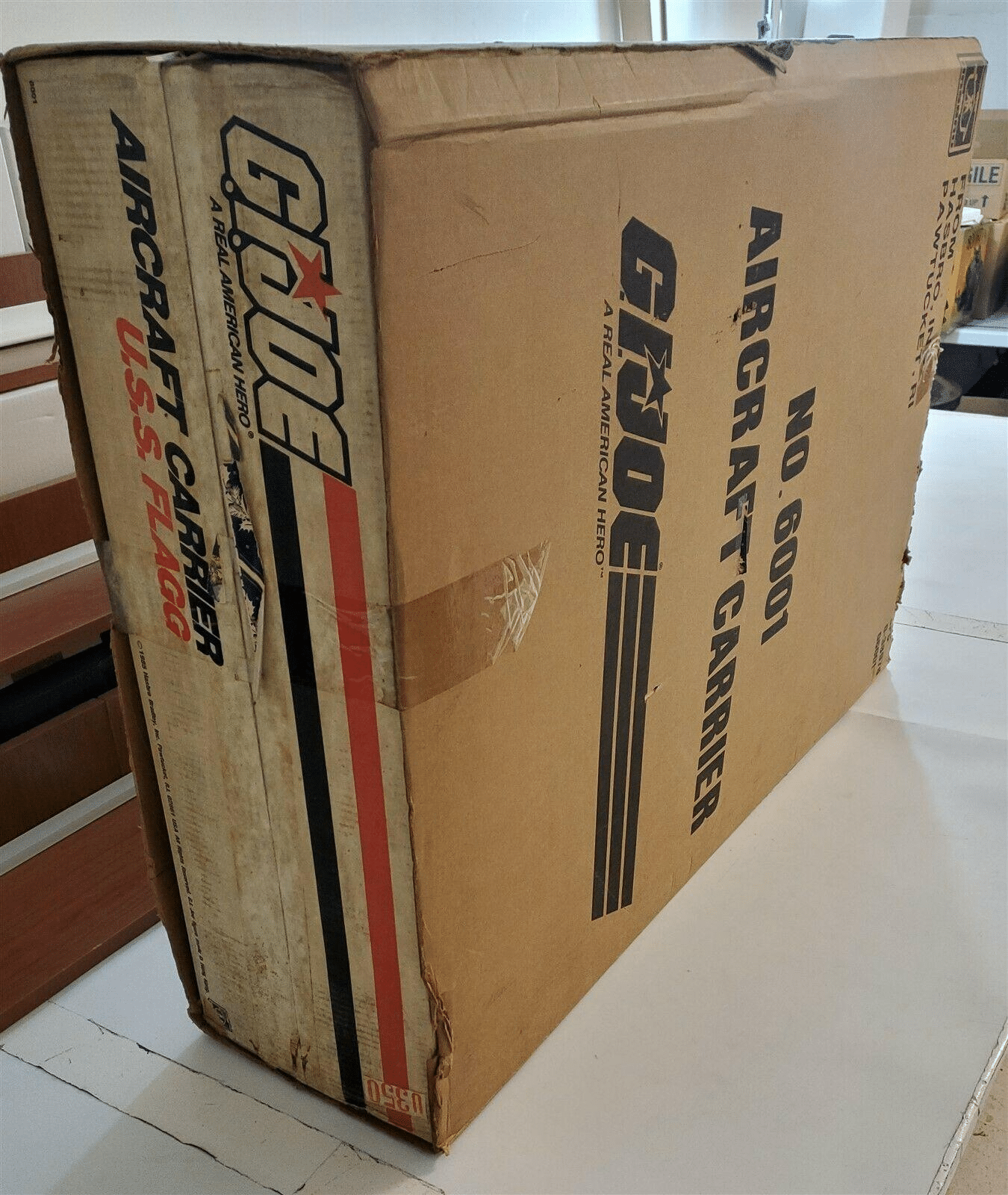 An image of a factory-sealed USS Flagg Aircraft Carrier released in 1985. It is third for the most expensive GI toy to have ever been sold.